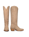 A pair of tall, tan cowboy boots with intricate stitching and wooden heels, displayed against a black background.