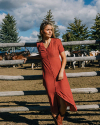 Woman outside wearing Women's Short Sleeve Button Front Midi Dress in the color Multi Geo Floral Stripe.