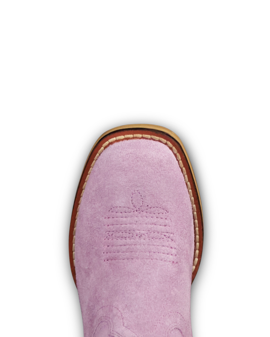 Close-up of the toe of a pink suede cowboy boot with decorative stitching, visible brown sole, and white welt stitching.