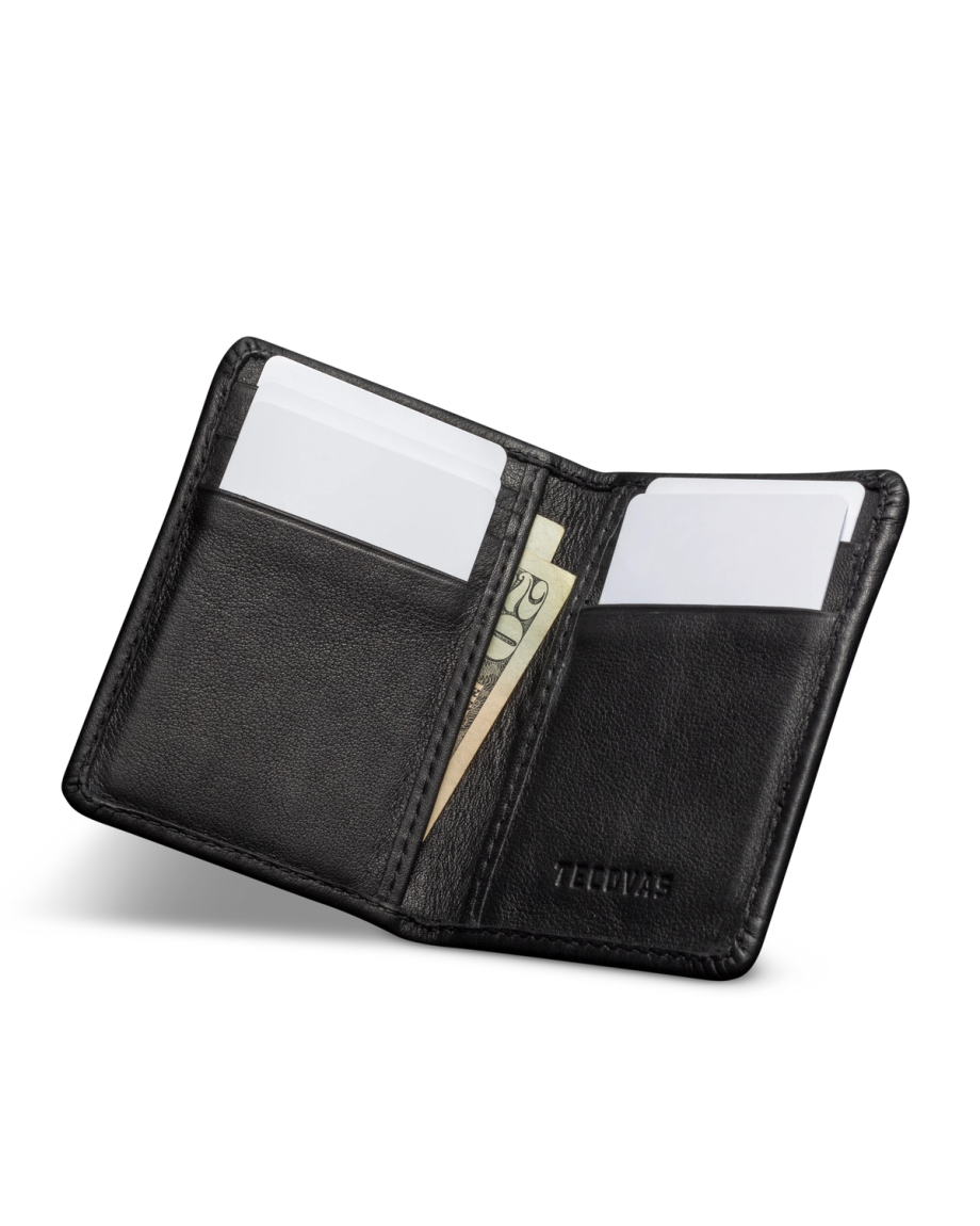 An open black leather wallet with two cards and a folded $20 bill inside.