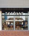 Storefront of Tecovas featuring large glass windows, displaying boots and western wear, with the store name prominently displayed above the entrance.