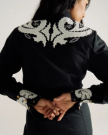 Back view of Women's L/S Applique Mini Dress - Black on model