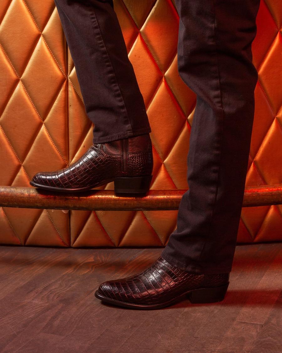 Man wearing The Dean Black Cherry Zip boots