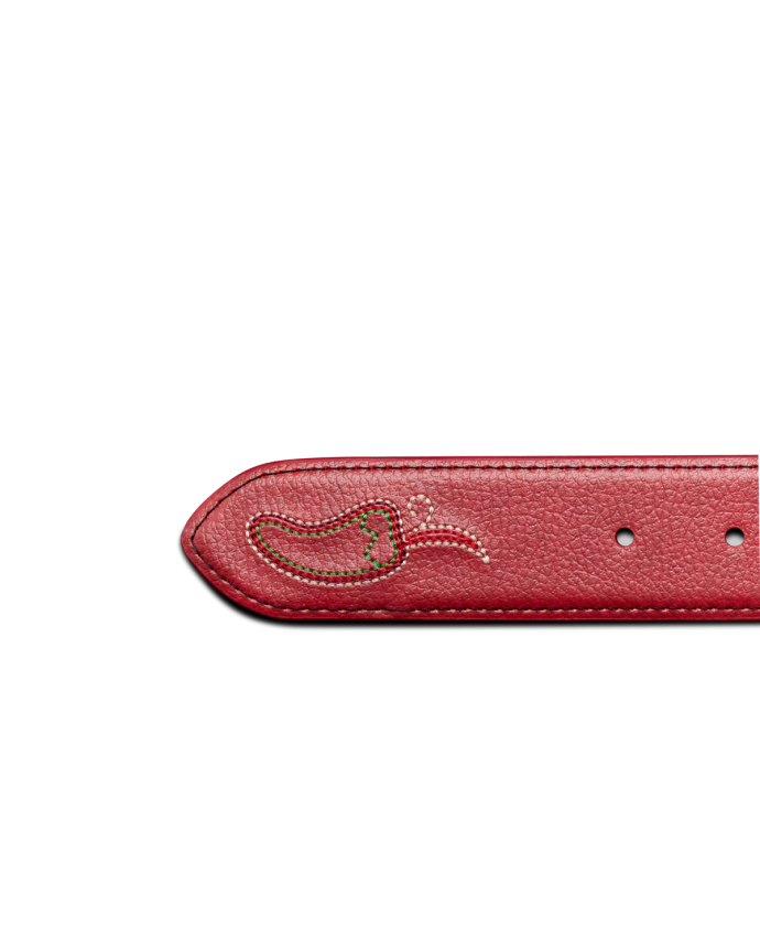 A close-up of a red leather belt with a stitched chili pepper design near the tip and three adjustment holes visible.