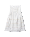 White strapless dress with subtle lace detailing and pleated sections, laid flat on a black background.