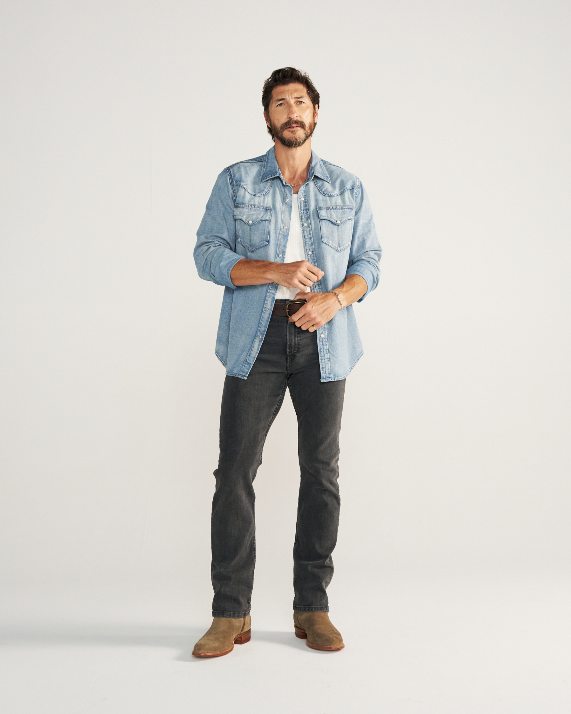 Closeup detail view of Men's Denim Pearl Snap LS - Light Wash