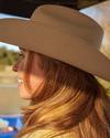 Woman wearing a cowgirl hat