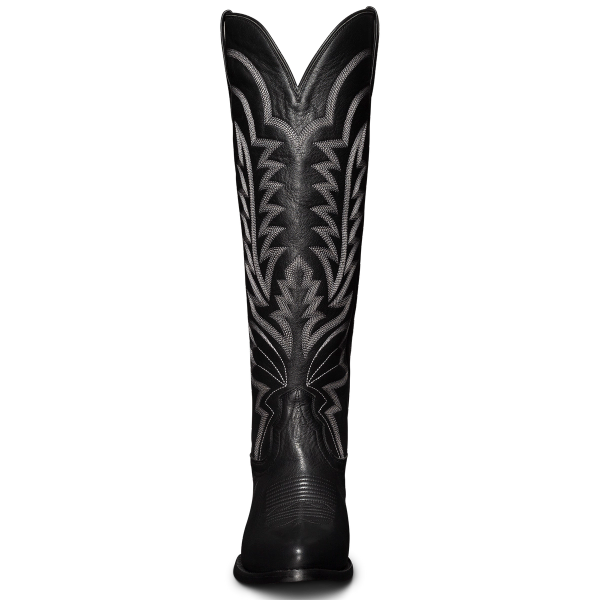 Tall black cowboy boot featuring intricate white stitching design on the shaft.
