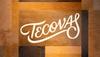 The image shows the word "Tecovas" written in a cursive font on a patchwork background of various shades of brown leather.