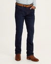 man wearing premium standard jeans in dark wash