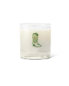 A white candle in a clear glass holder with a green illustration of a cowboy boot on the front.