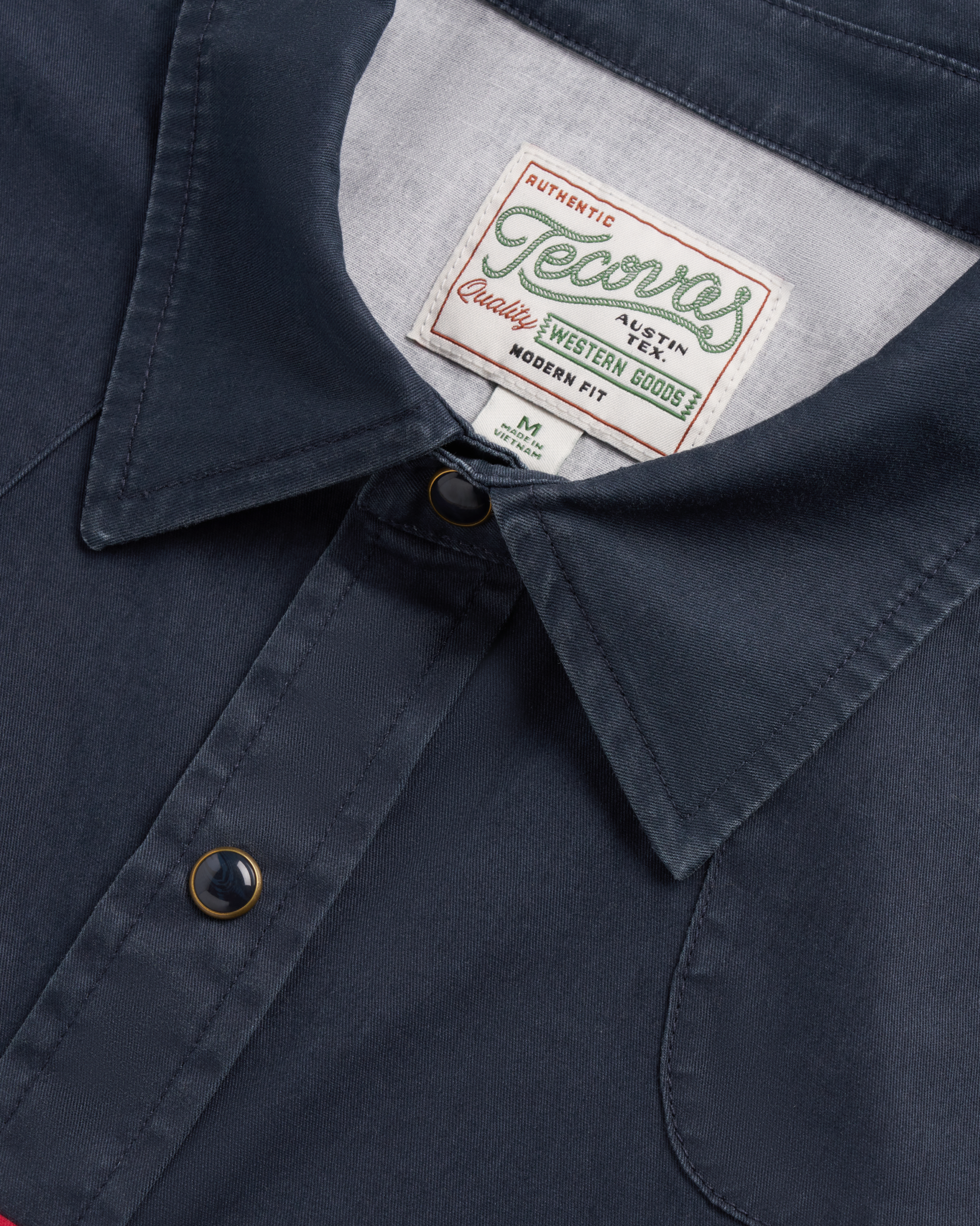 Closeup detail view of Men's Thorn Stopper Pearl Snap LS - Navy / Khaki