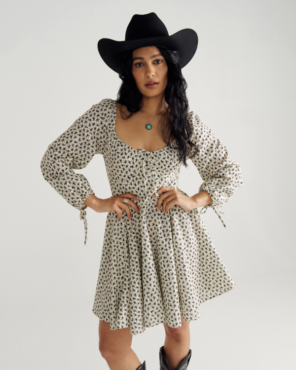 Front view of Women's L/S Mini Dress - Cream / Black on model