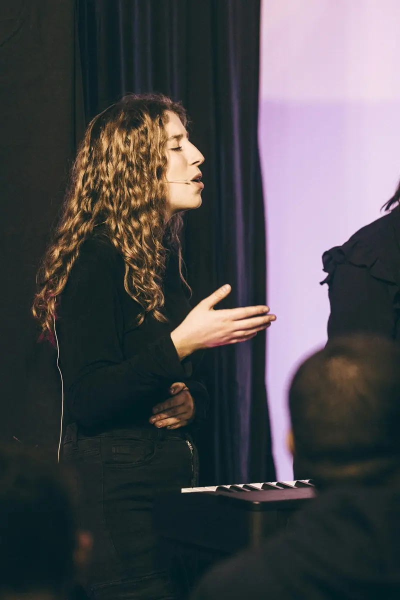 Confident woman giving a presentation at a conference