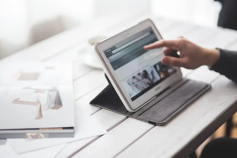 Person reviewing a presentation on a tablet device