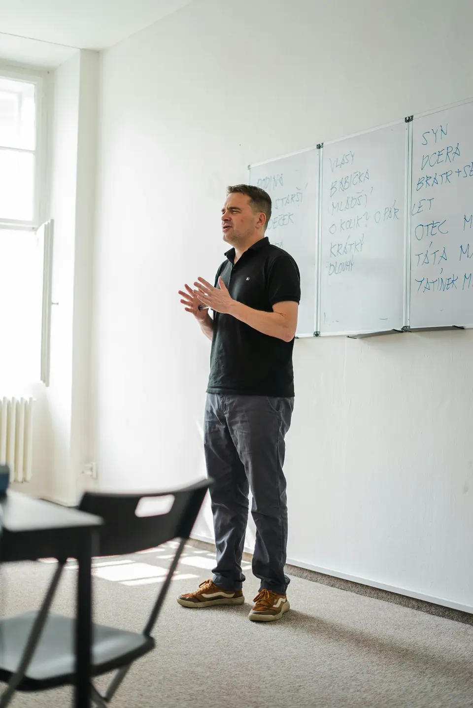 Confident pitch coach speaking to a group