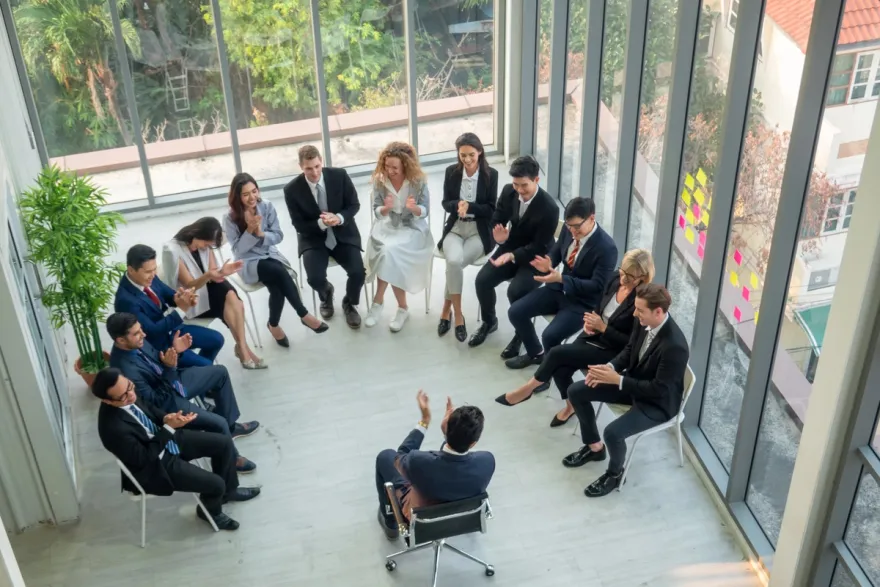 Professional team workshop with group of business professionals in a collaborative discussion circle