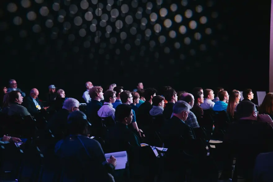 Keynote speaker presenting to a conference audience