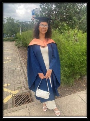 Full body shot of Tayla in graduation gown