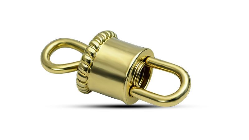 A gold barrel clasp for jewelry.