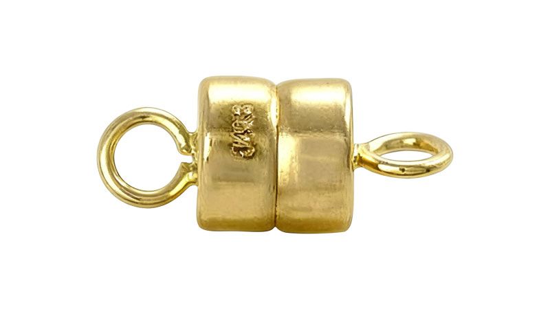 A gold magnetic clasp for jewelry.