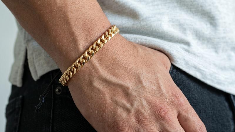 Gold Miami Cuban link bracelet worn on wrist