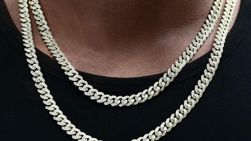 Silver iced-out Cuban link chains with pavé stone setting