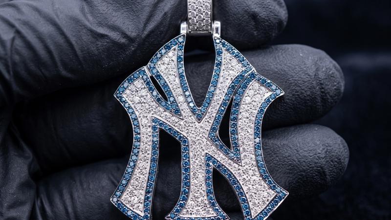 Custom iced-out logo pendant with interlocking letter design
