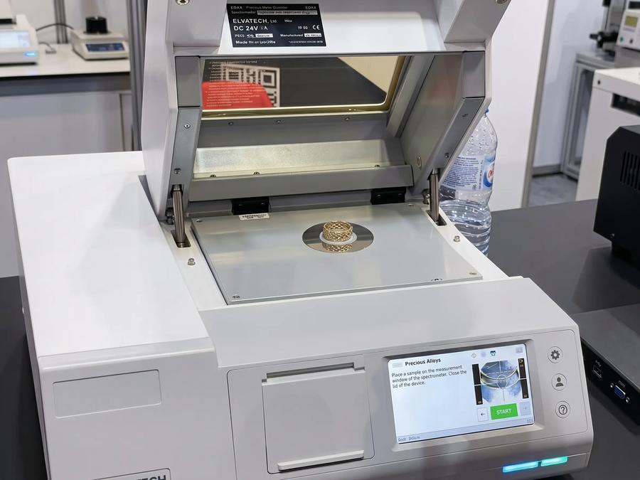XRF analyzer testing the material composition of a jewelry sample