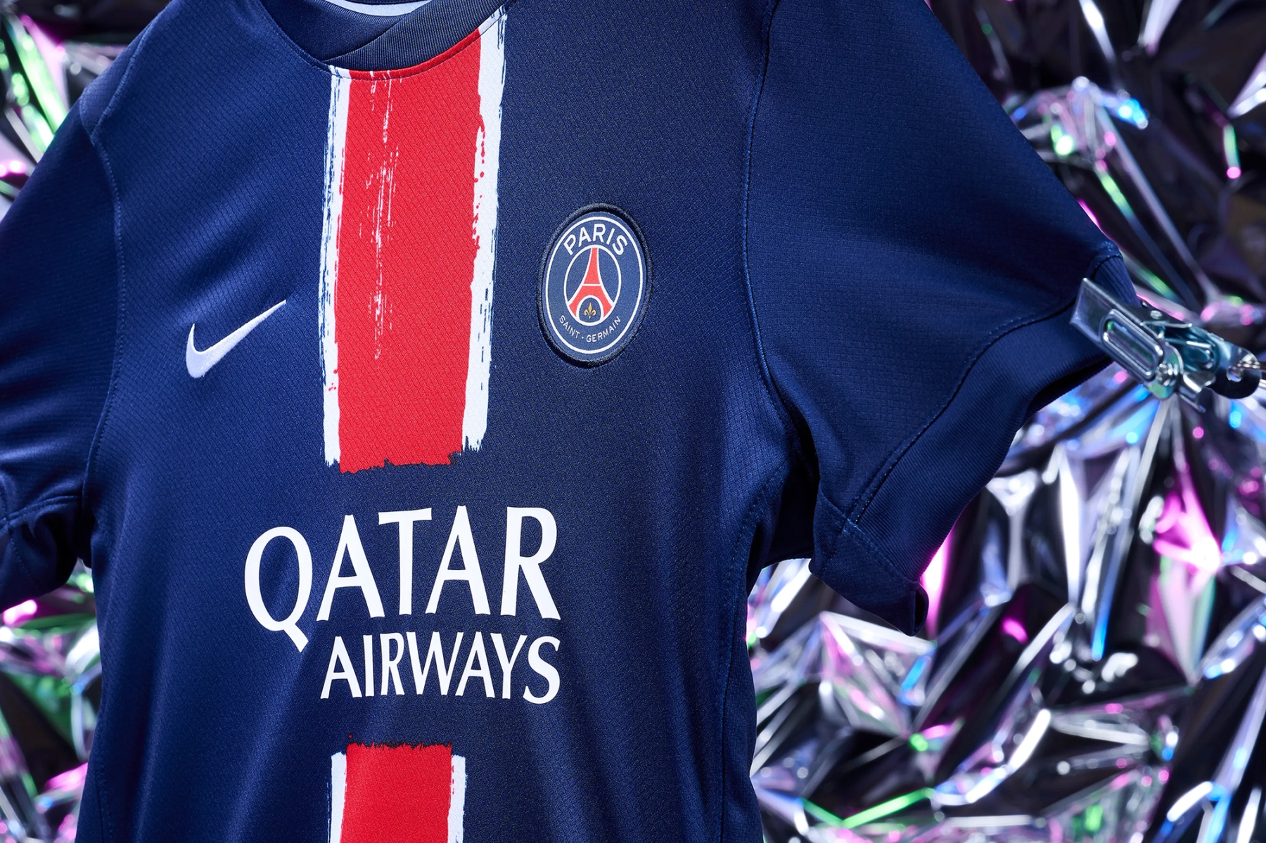 PSG home kit centred against full holographic silver and pink backdrop, Christmas campaign still life photography Manchester
