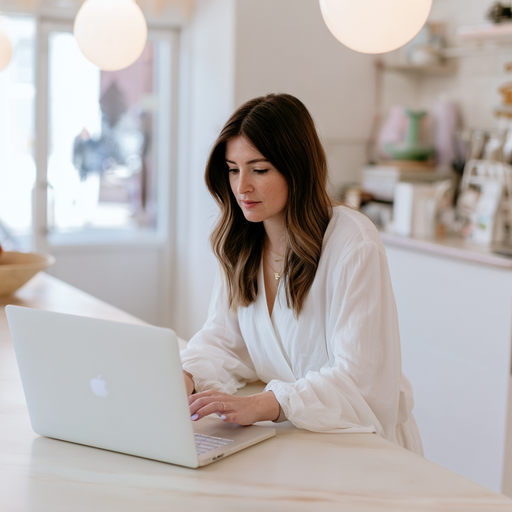 A small business owner using simple AI tools on a laptop—automating tasks like emails, scheduling, and customer communication without a technical team.