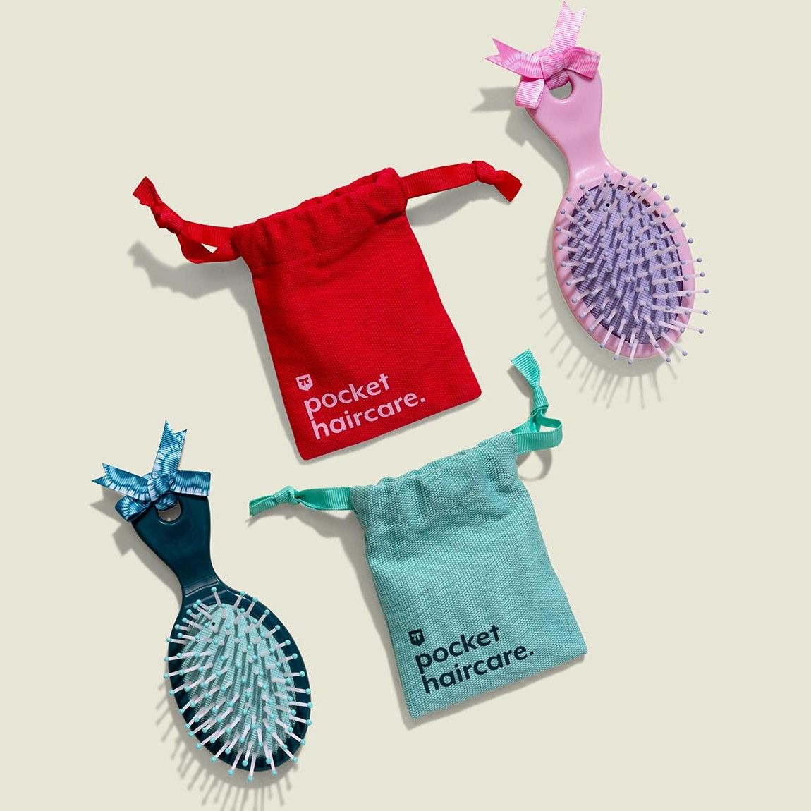 Drawstring pouches with hair brushes 