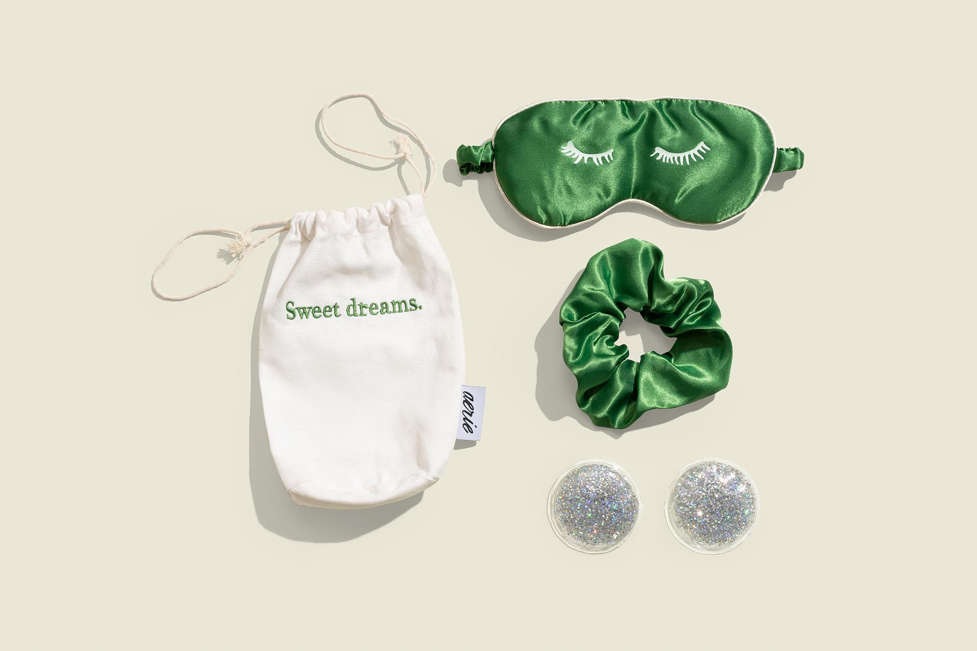 Drawstring pouch with scrunchie, sleep mask and glitter eye gel