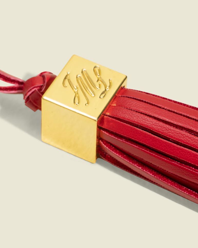Red tassle with metal details