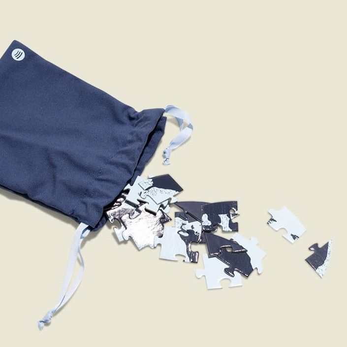 Drawstring pouch with puzzle pieces 