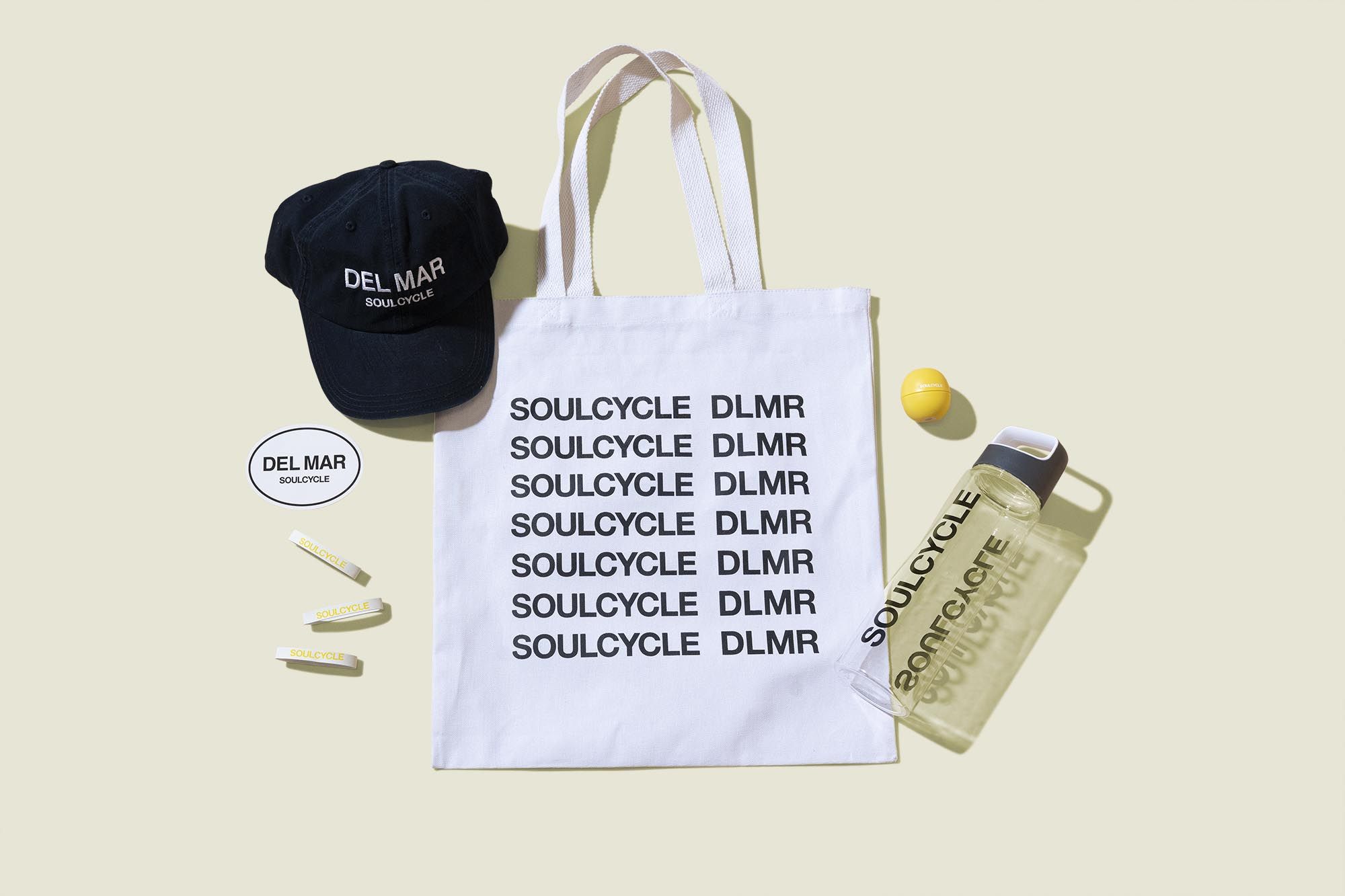 Tote bag with water bottle, wrist bands, hat, lip balm and sticker 