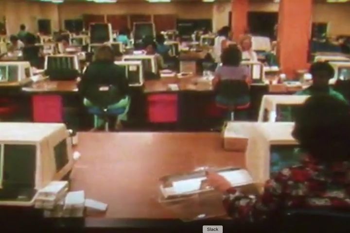Vintage 70s era footage of a busy office 