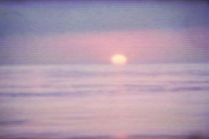 Vintage film of a pink and purple sunset