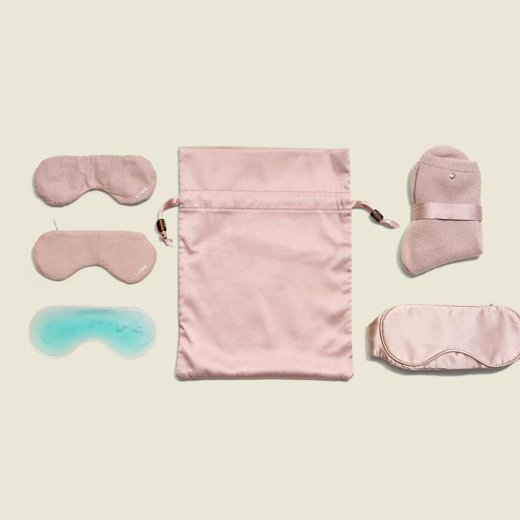 Drawstring pouch with satin sleep mask and socks 