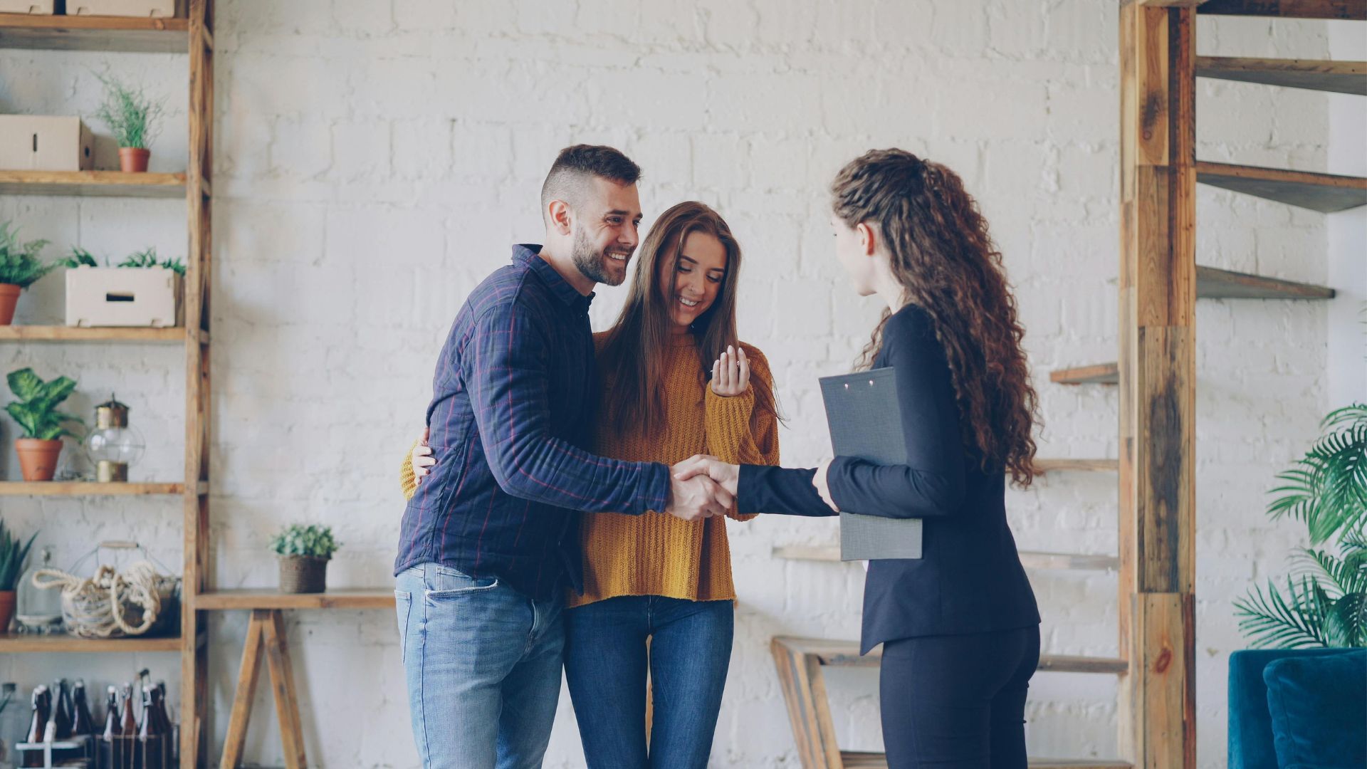Home seller meeting with a real estate agent to discuss commission fees and home sale costs