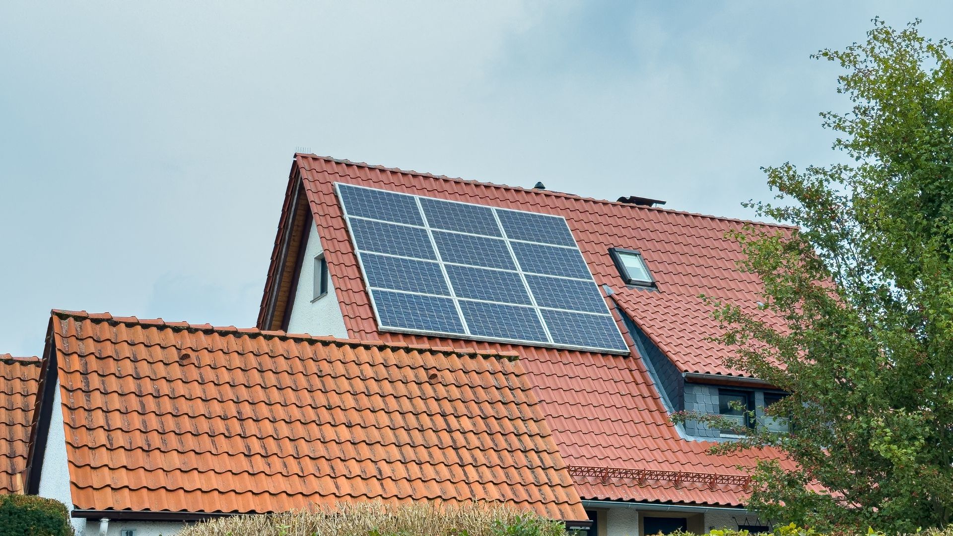 house with rooftop solar panels and increased home value