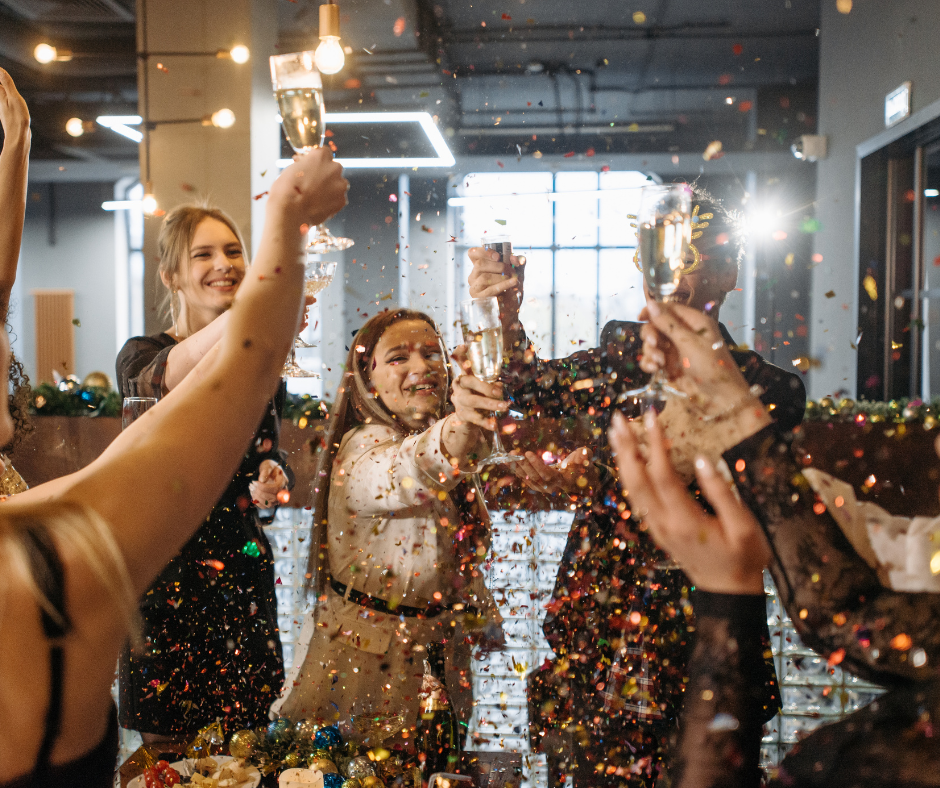 Work Christmas Party with employees toasting 