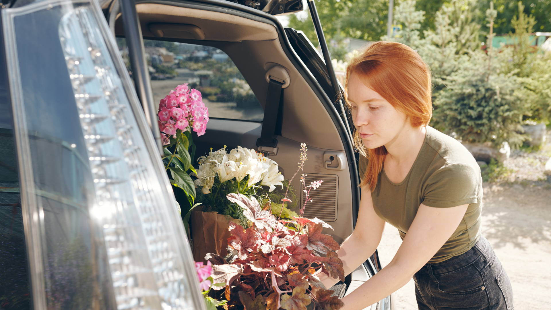 Florist using car for deliveries