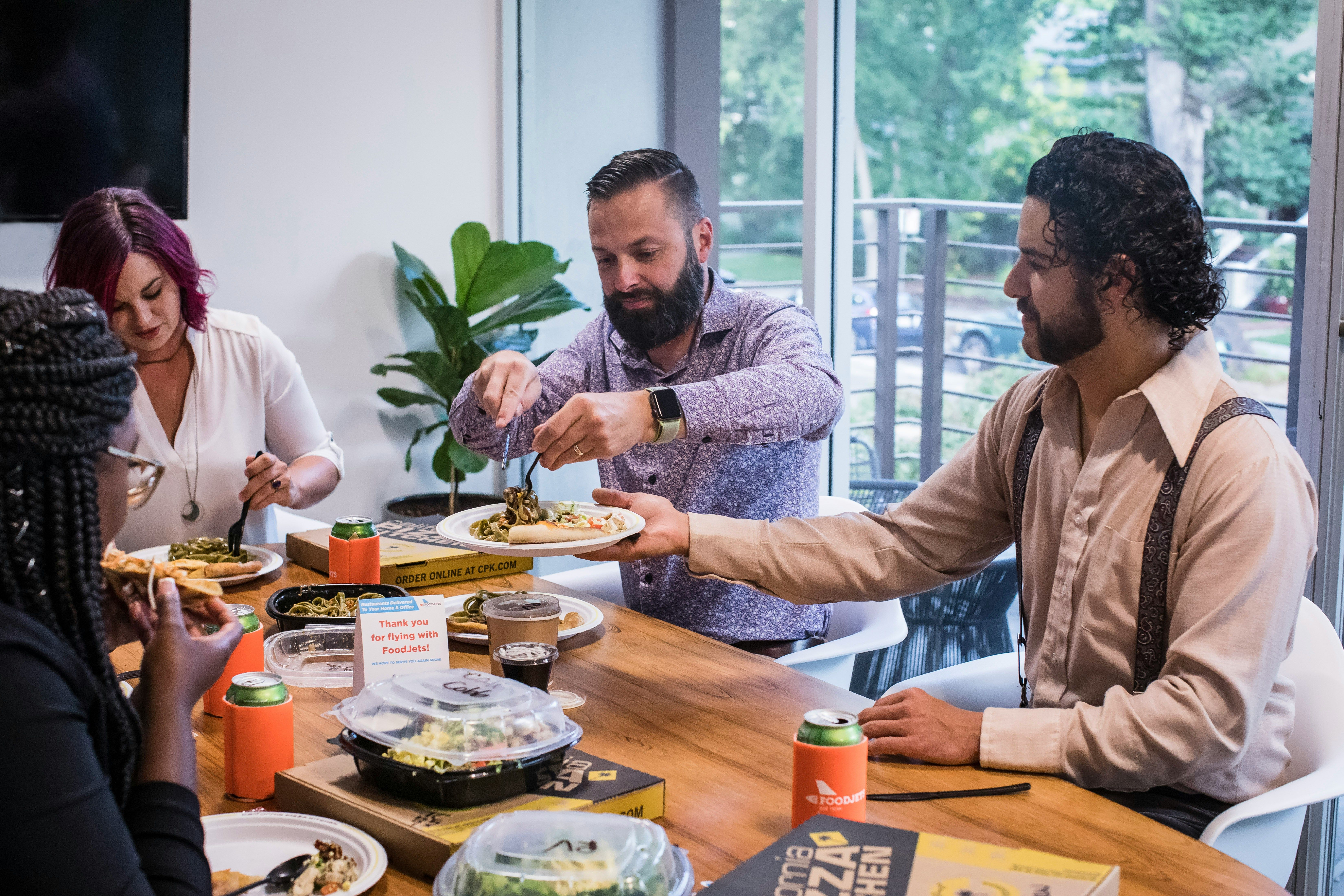 People eating business lunch as an example of Fringe Benefits Tax related expenses