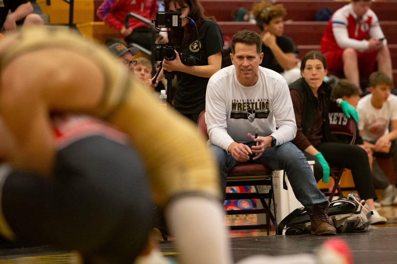 Brett Anderson coaching his son Owen from the corner during the semifinals of the 2024 Tom Dubois Tournament at Richmond-Burton High School.