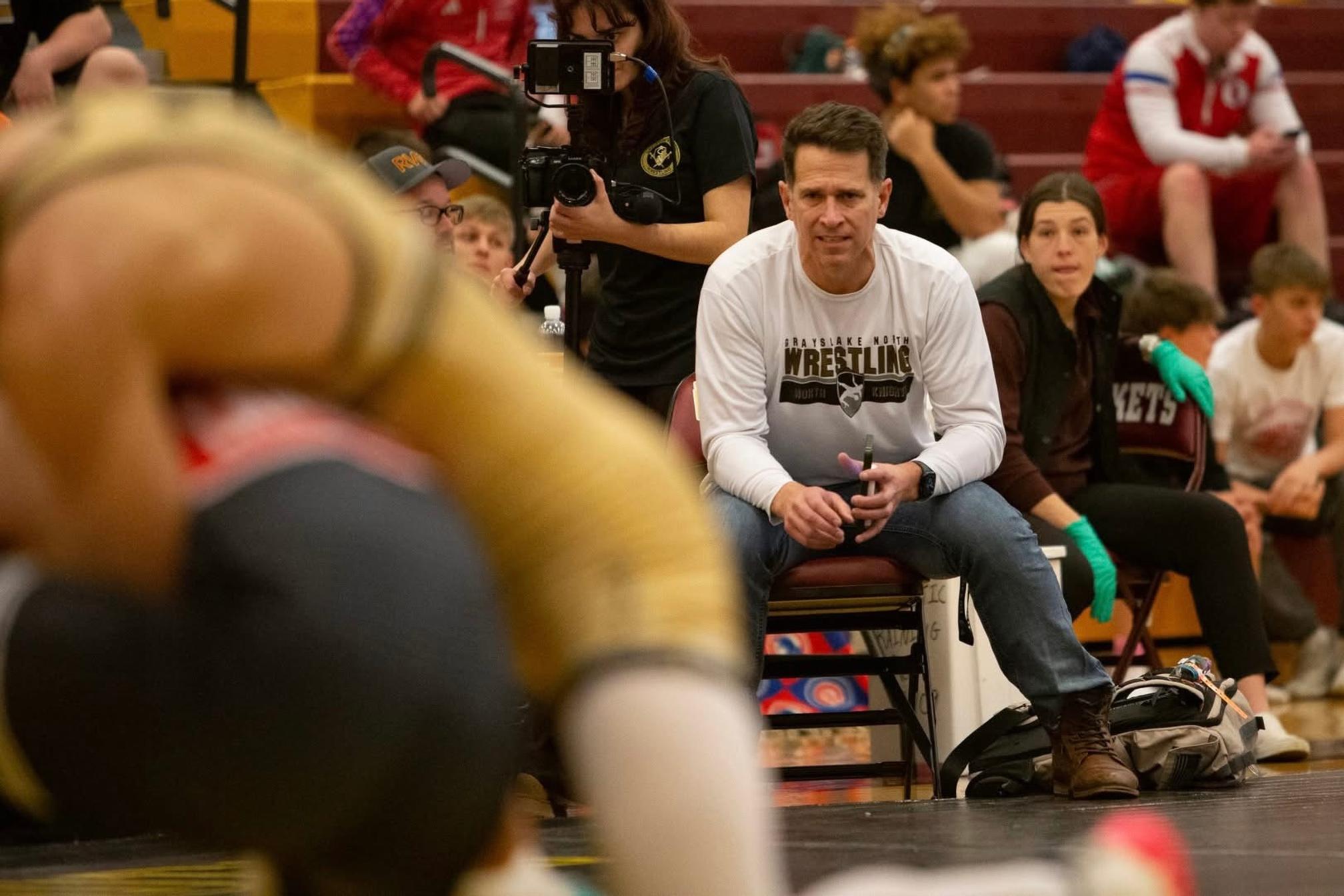 Brett Anderson coaching his son Owen from the corner during the semifinals of the 2024 Tom Dubois Tournament at Richmond-Burton High School.