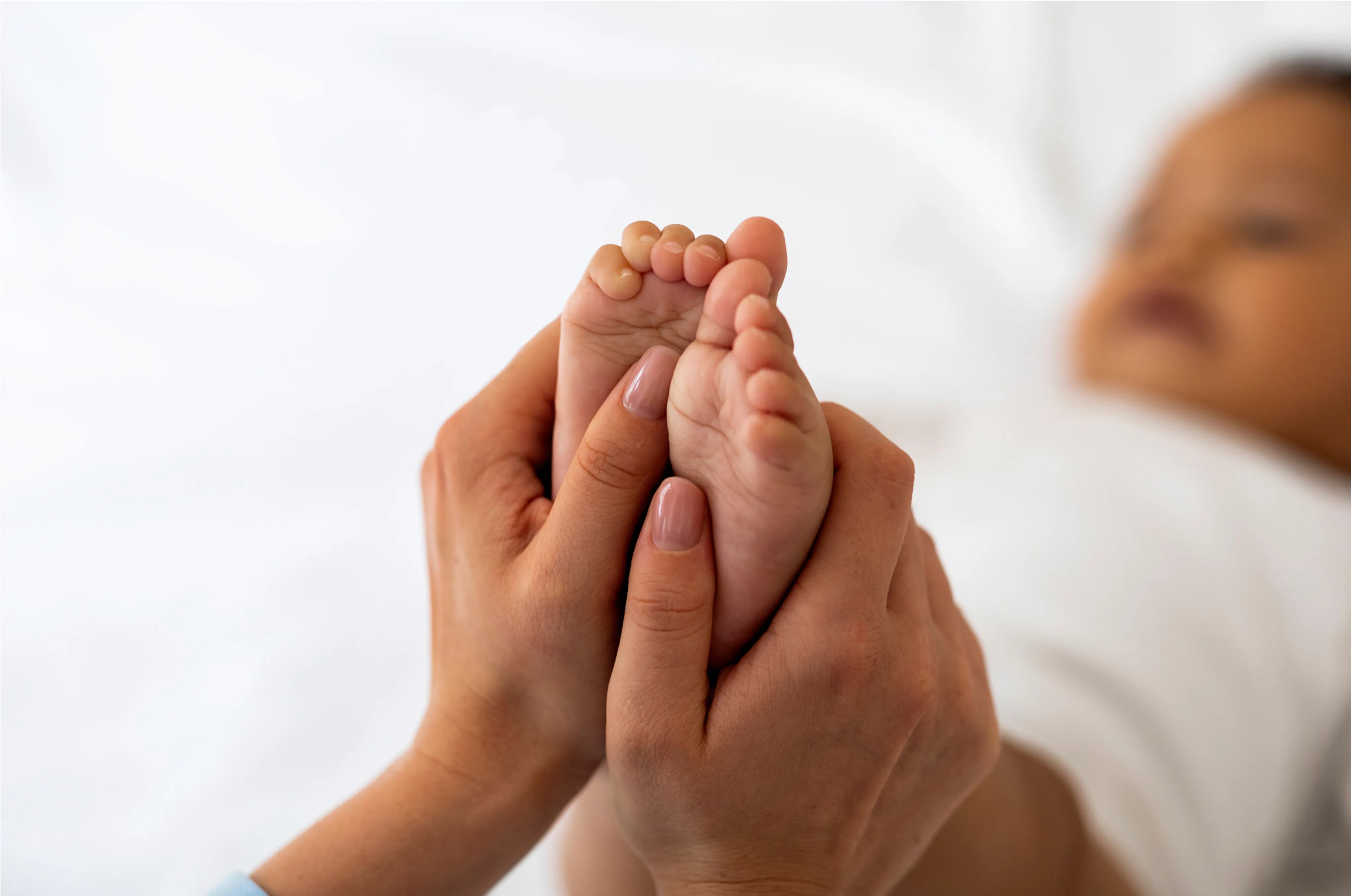 Babie's feet being held