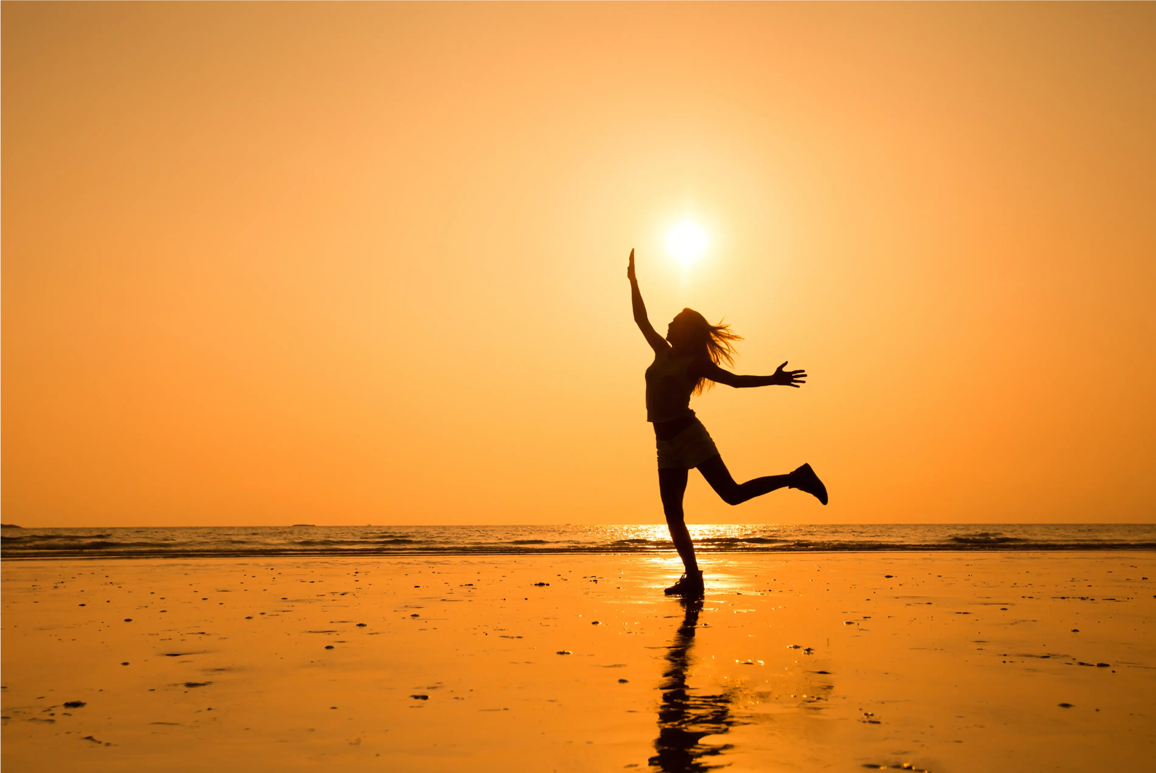 Womans silhouette on a sunny bay