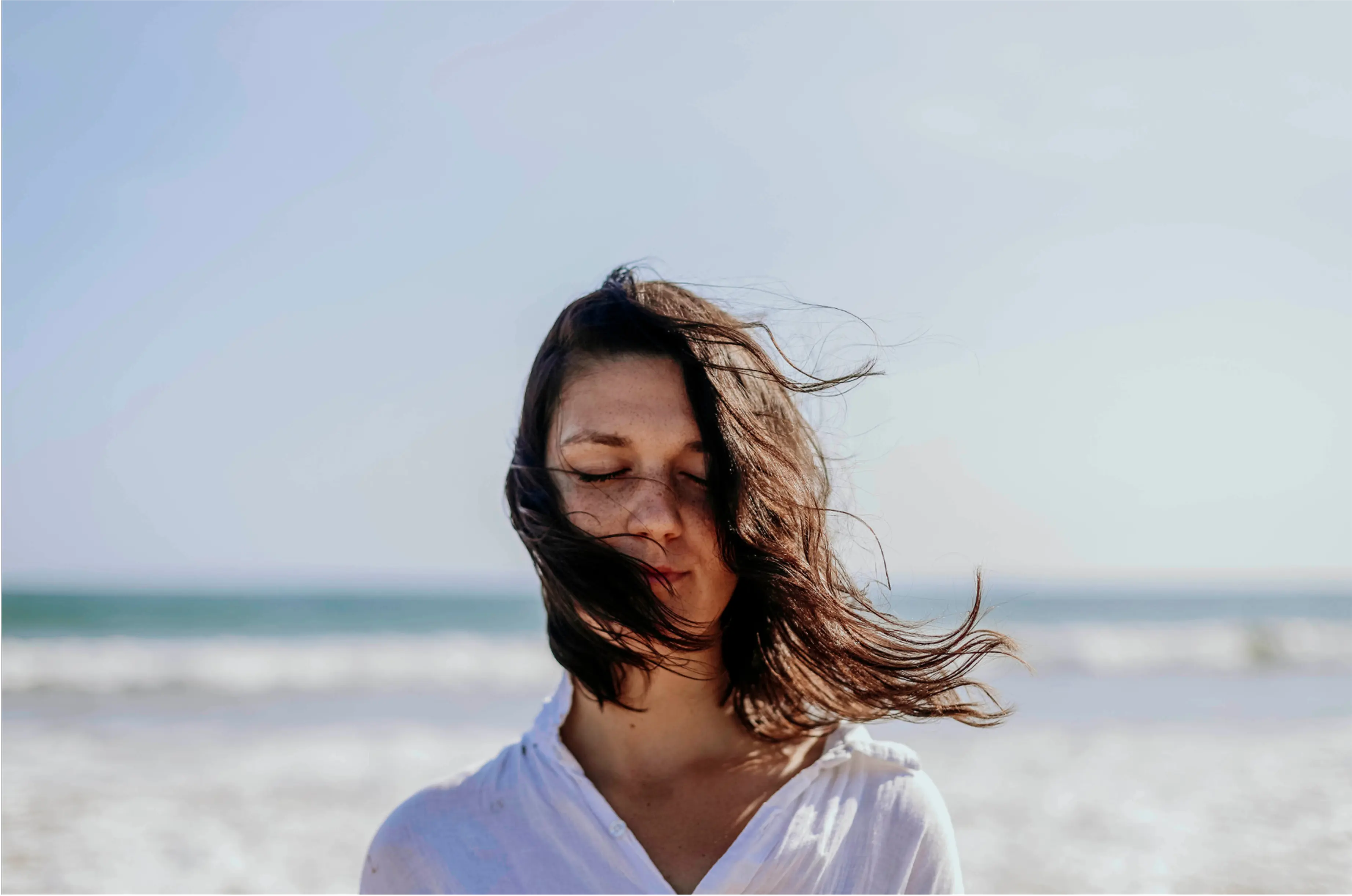 Woman standing on a beach