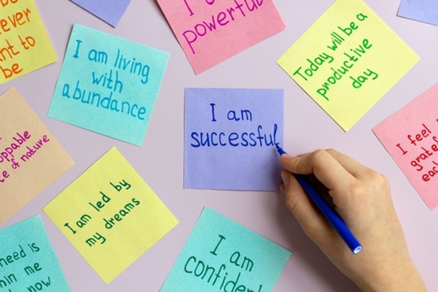 coloured post-it notes with inspiring messages